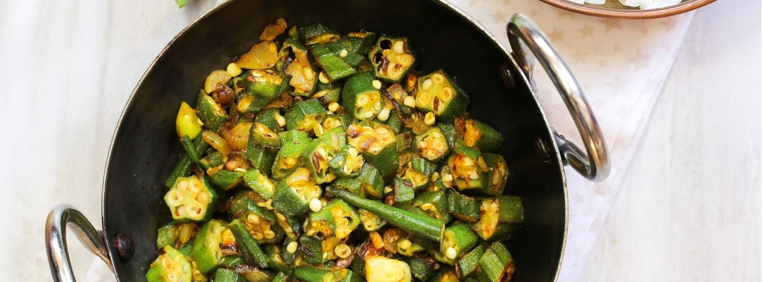 Bhindi Masala recipe card with a photo of the dish and preparation details.