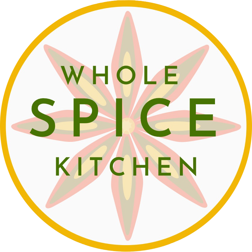 Logo with tri colored star anise inside a saffron yellow circle with green text that reads "Whole Spice Kitchen"