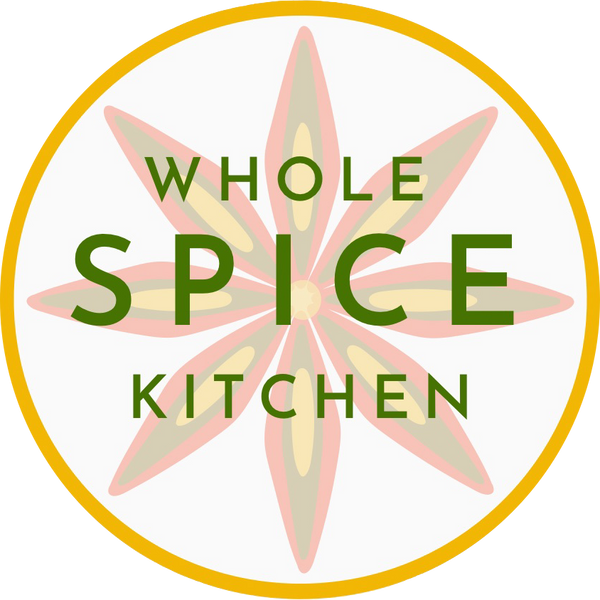 Logo with tri colored star anise inside a saffron yellow circle with green text that reads "Whole Spice Kitchen"